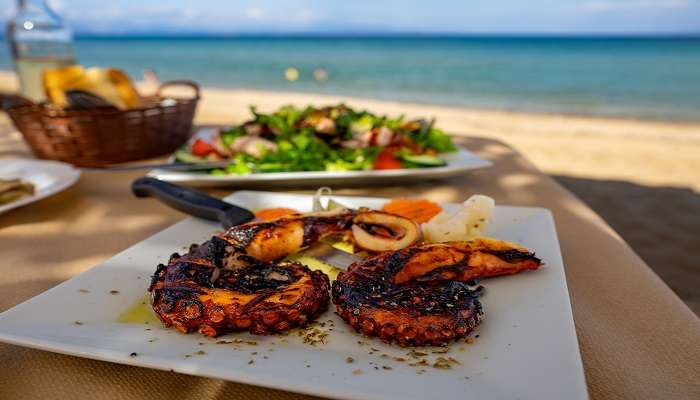 Seafood Platter with blue sky and ocean at the top restaurants near Agonda Beach.