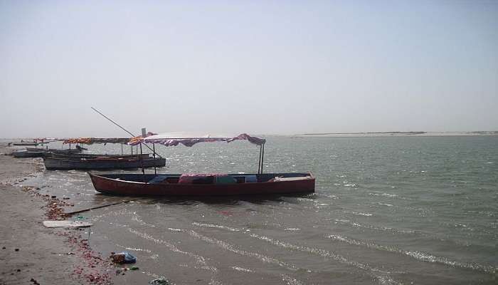 A picture of the stunning Saryu River with boats on its surface 