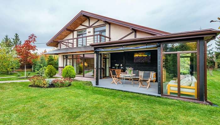 A cottage with terrace and backyard