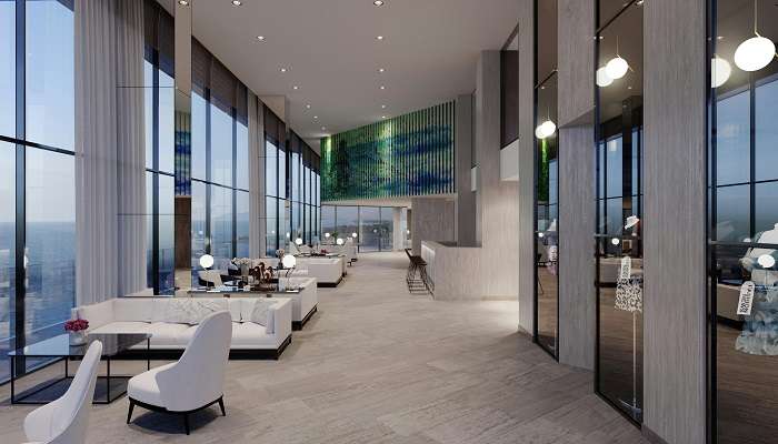 A stunning lobby of a modern hotel with sceneries on the wall
