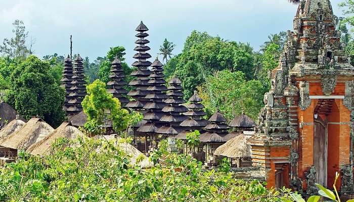 Distinctive multi-tiered pagodas and water features at Temple.