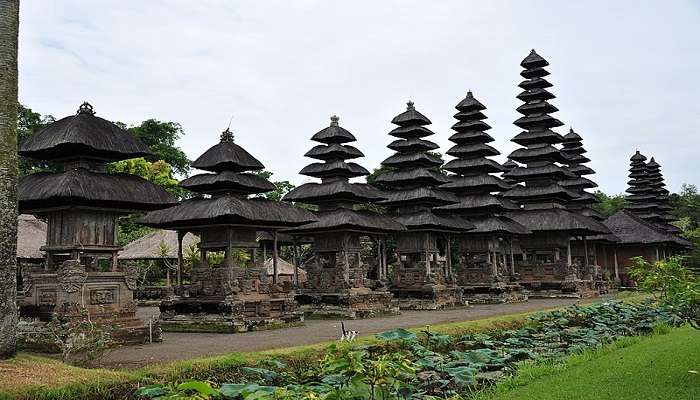 A scenic view down the pathway through the Taman Ayun Temple in Bali.