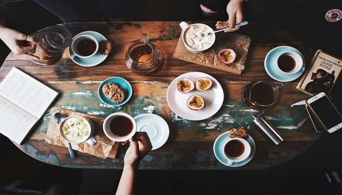 Taste in the first sip of coffee at the Ganga View Cafe while looking at the river