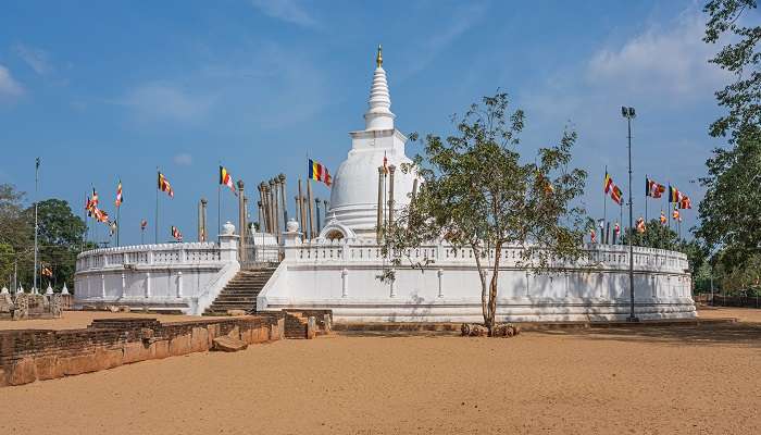 Panoramic view of restored Thuparamaya Dagoba with white bell shaped Stupa
