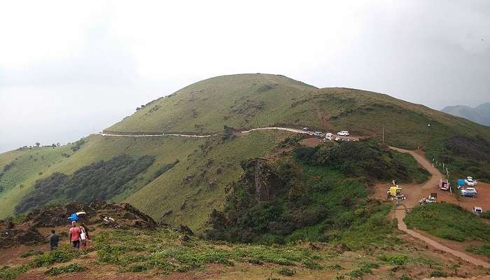 One of the best things to do in Belur is to park vehicles on the peak of Chikkamagaluru Hills, Karnataka.