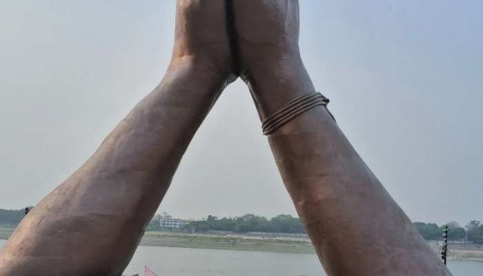 A person doing yoga at the Namo ghat with scenic views.