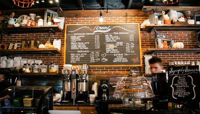 Barista brewing coffee in a coffee shop, cafes in hervey bay