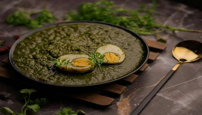 Dine at Banamo Kitchen and Bar, which serves green masala egg curry.