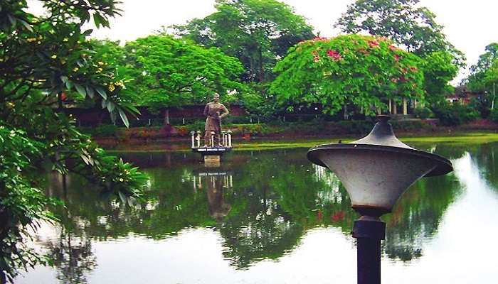 A vast tea garden in Tinsukia showcasing rows of lush green tea plants highlighting Tinsukia's renowned tea industry.