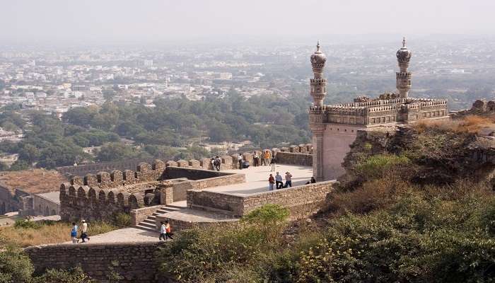 Ruins of Bhismaknagar Fort surrounded by lush greenery in Anini