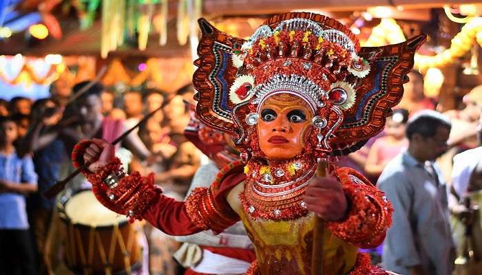 Witness the beauty of Theyyam during your visit to Trichur Forest. 