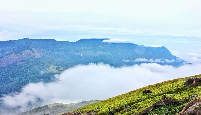 The Velliangiri foothills touching the clouds in Tatabad.