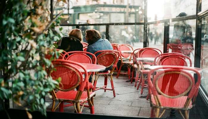 Photos of chairs and tables on a cafe patio, cafes in hervey bay