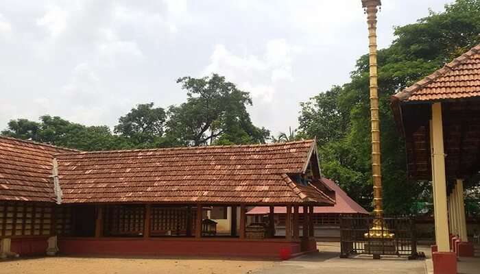 Side view of the yellow and brown wall of the temple under the daylight