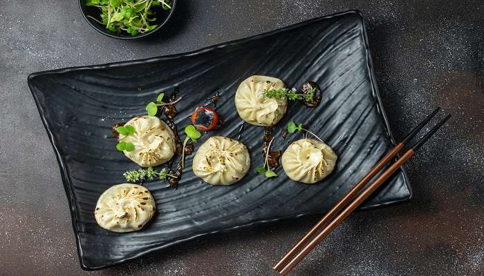 Eat momos at the Food Feast Restaurant, one of the best restaurants in Itanagar.