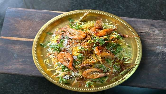 A delicious plate of biryani served at Gufha Restaurant, a popular dining spot among restaurants Near Mysore Palace