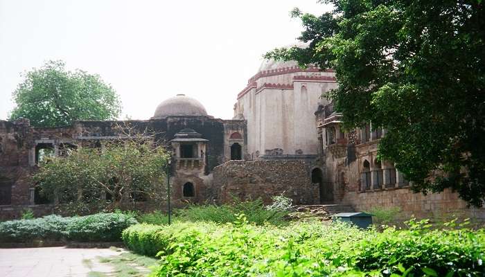 The picturesque Hauz Khas Complex with historic ruins and a serene lake.