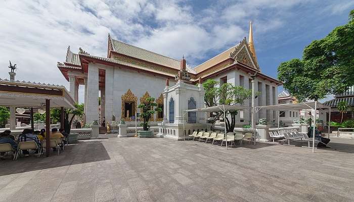 Vibrant golden statue of King Rama IV at Wat Bowonniwet Vihara Bangkok 