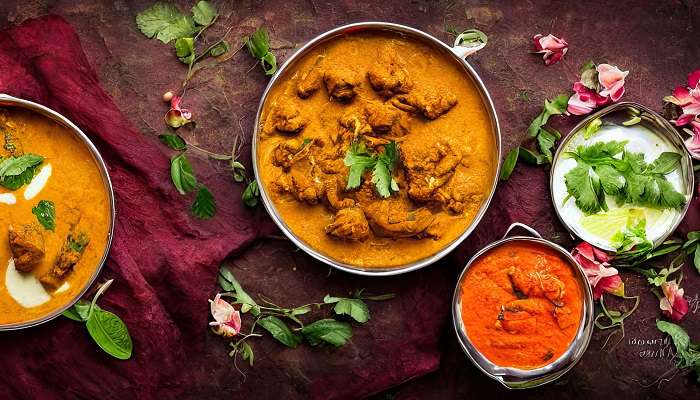 Spicy mutton curry served on a plate at Hotel RR Mysore