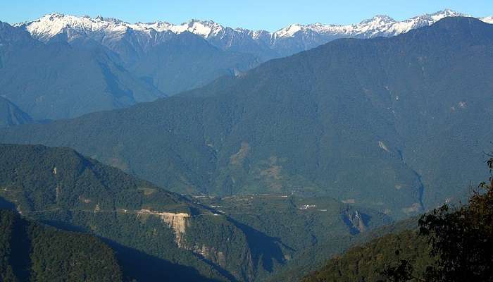 See the clear and snow-capped mountains in Hunli, one of the best places to visit in Roing.