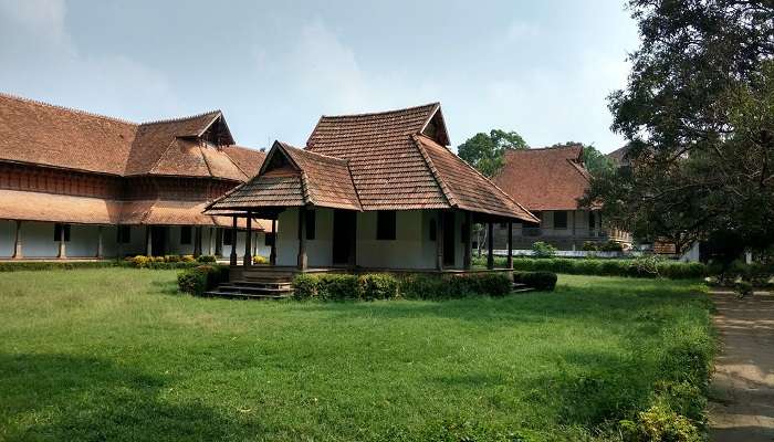 Kanjiramattom Palace, roughly 28 km from the Aruvikuzhy Waterfalls.