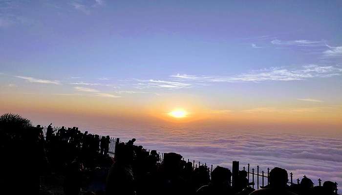 Sunrise over the cloudy blankets of Nandi Hills. 