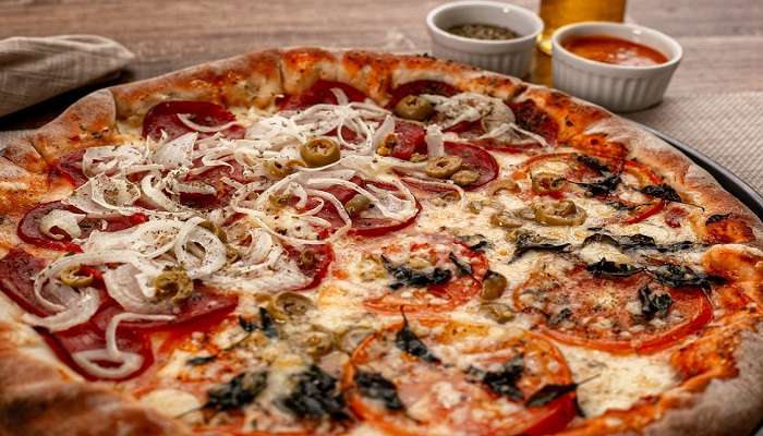 Relish gourmet cheesy pizzas at One Bite Restaurant, a leading Imphal Restaurants