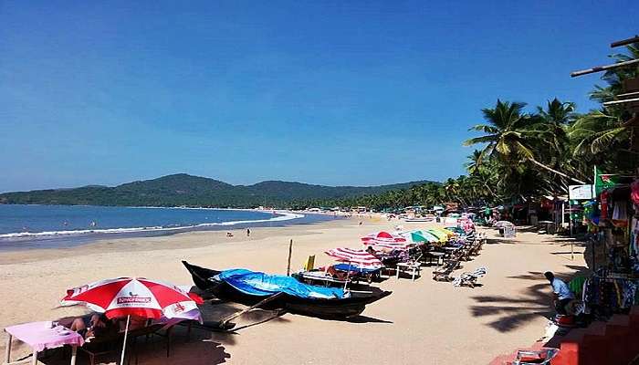 A couple of fisher boats parked on the shores of Palolem Beach