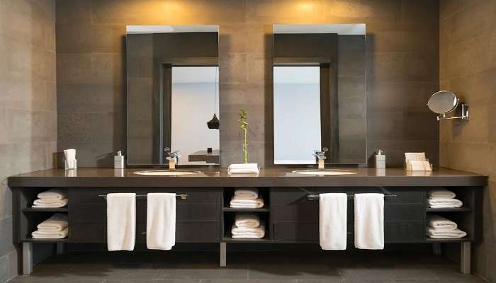 A clean washroom attached to a hotel room