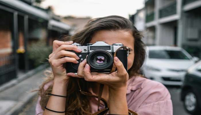 A tourist enjoying photography at dambatenne tea factory sri lanka