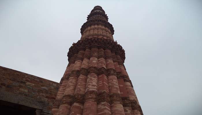  Known best for its towering height, the Qutb Minar dominates this shot of the historical monument near the Tughlaqabad Fort Delhi.