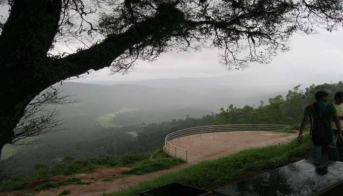 Misty landscape view of the mountain ranges and valley from Raja’s Seat near Chettalli