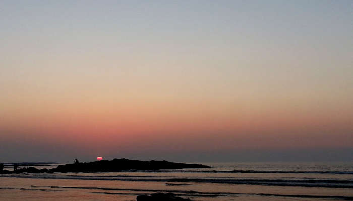 Beautiful and colourful clouds during sunset at Aksa Beach