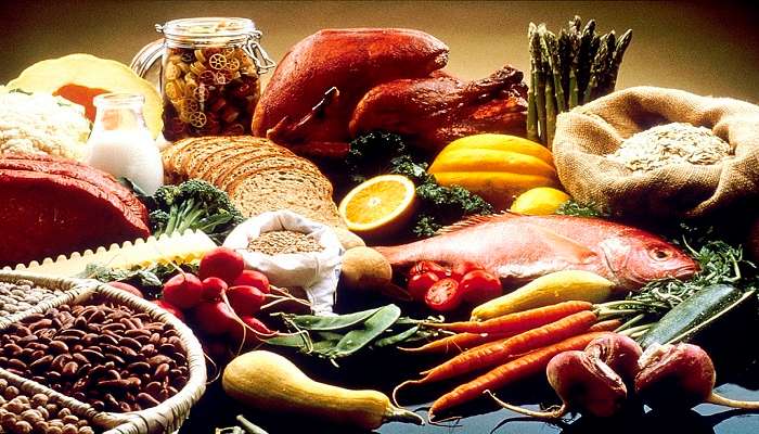 A table full of fresh produce and ingredients.