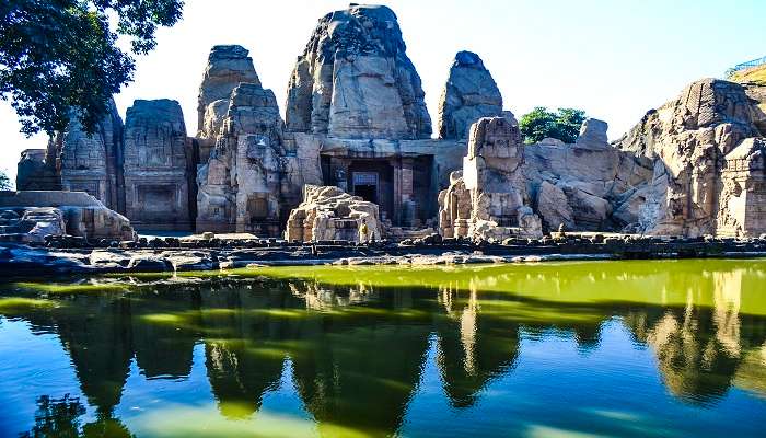 A panoramic view of the architectural layout of the Masrur Rock Cut Temple complex.