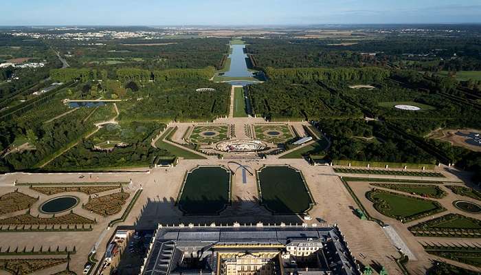 Ornate fountains and lawns in the Gardens of Versailles.