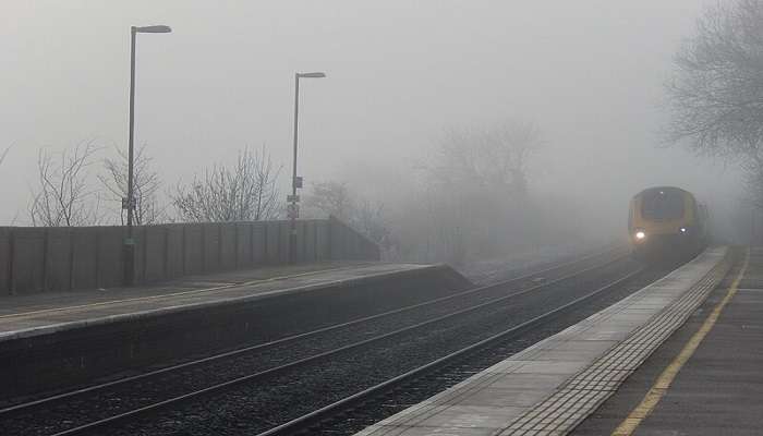 Rail approaching Tamworth Station amid fog.