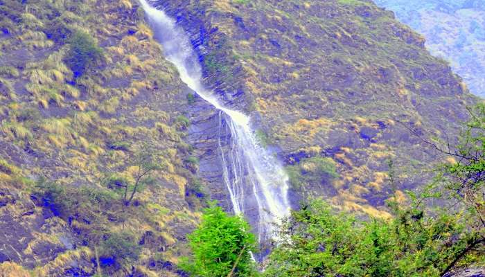 A view of Birthi Falls at snowfall in Munsiyari