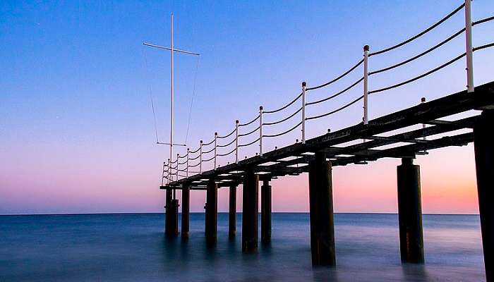 A bridge suspension near the waterbody.