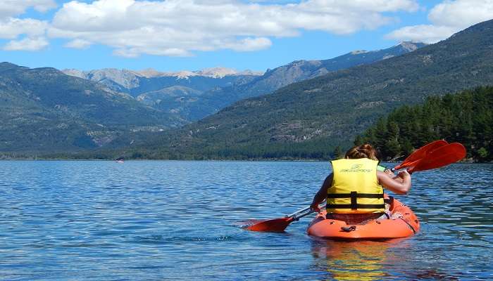 Paddling a kayak with an incredible scenery of hills around.