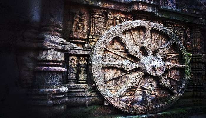 Closeup of beautiful Flag Pole, Chariot and embossed god pictures and exterior view of garbha gudi.