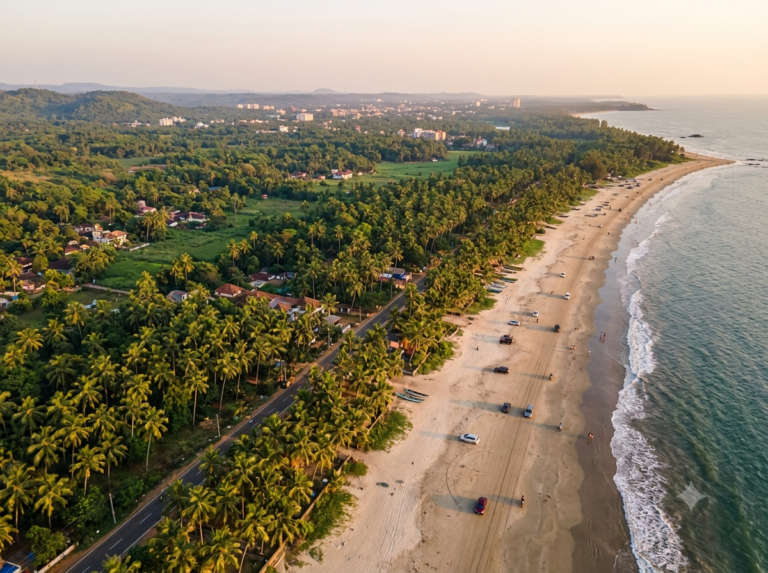 Aerial view of Kannur and Muzhappilangad Drive-In Beach, India, at golden hour