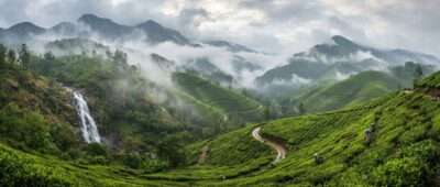 Monsoon clouds over green tea gardens in Munnar, one of the best places to visit in Kerala in July