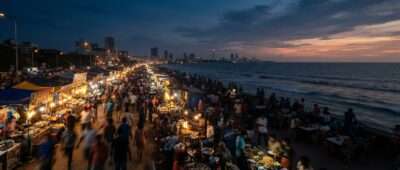 Galle Face Green night market food stalls glowing at dusk beside the sea in Colombo