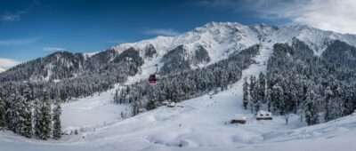 Snowfall in Jammu and Kashmir: Gulmarg meadow and Apharwat Peak under fresh snow with the Gondola